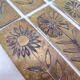 Six cleanliness plaques, flower design, brass.