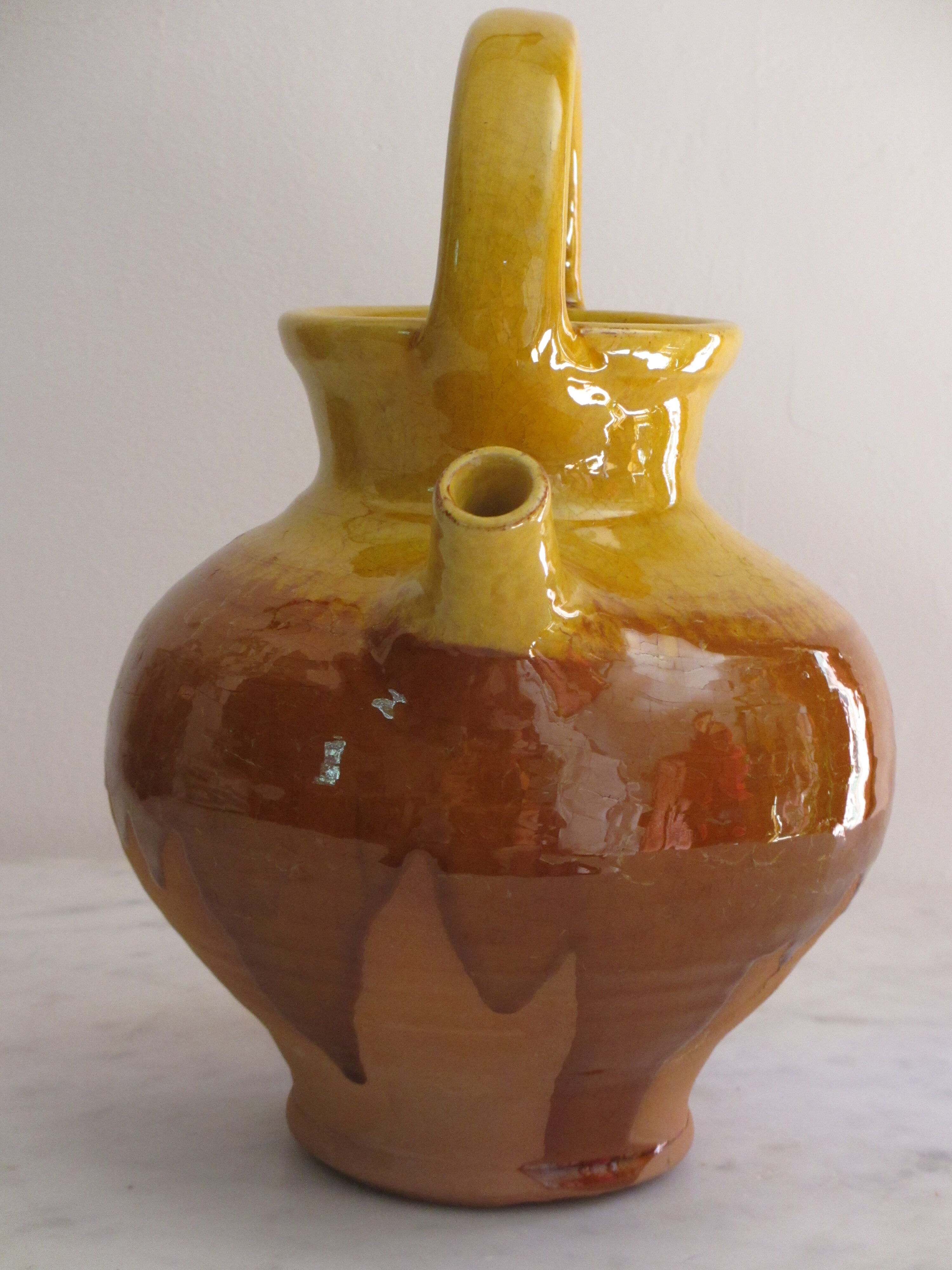 E-mailed terracotta jug or kid.