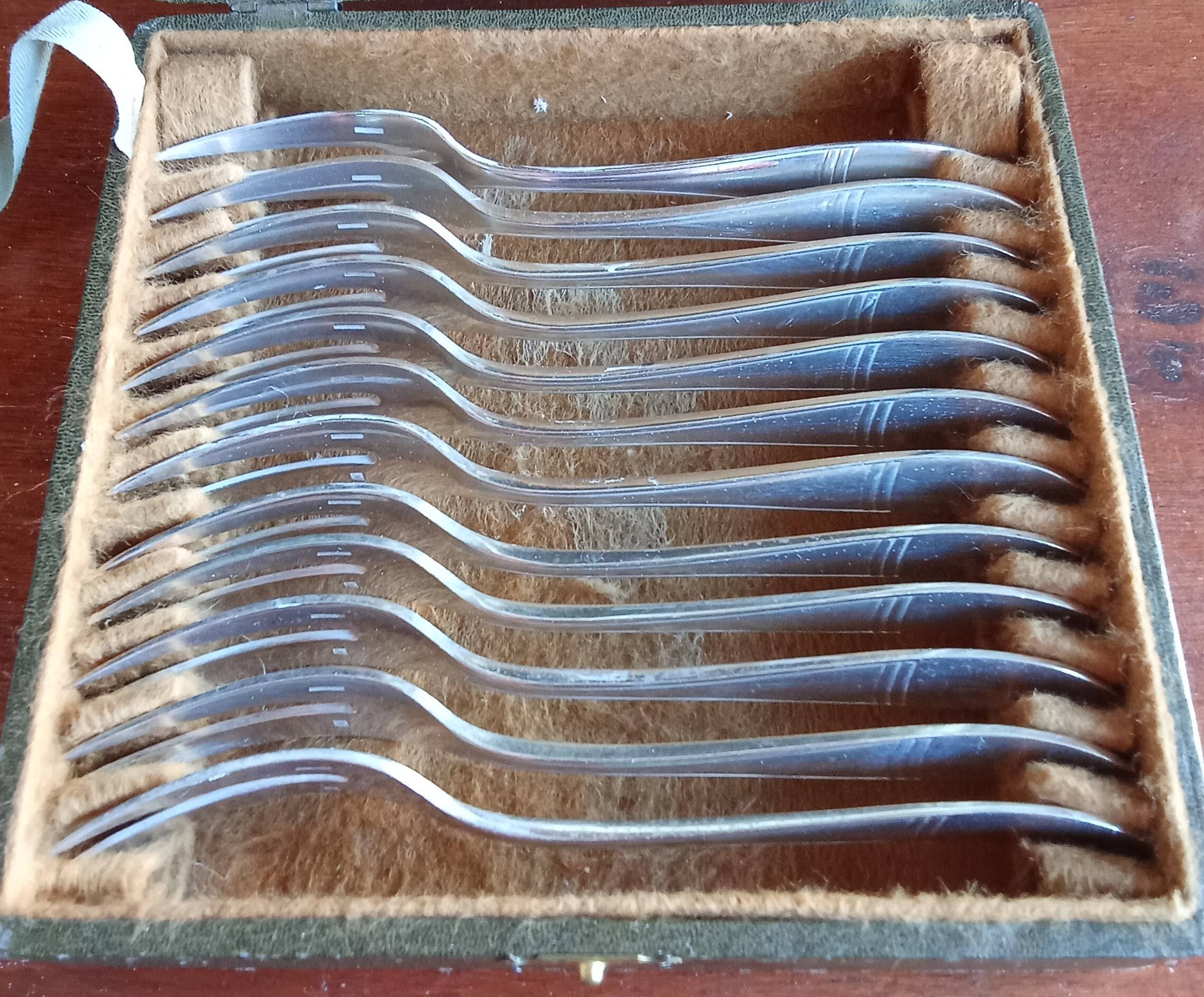 12 silver-plated metal condiment forks for shellfish by Christofle, Albi model.
