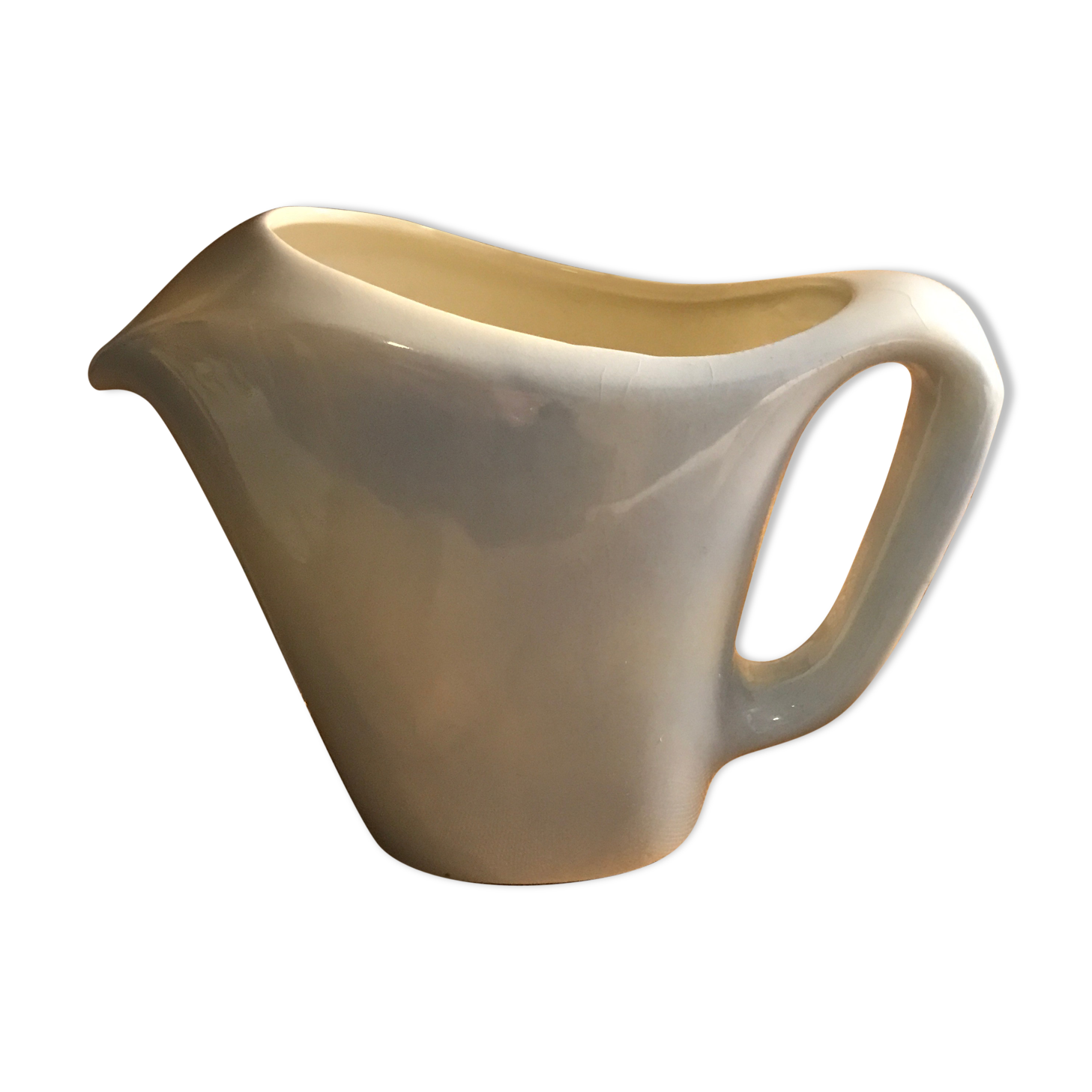 Light blue pitcher in vintage earthenware