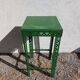 Green metal stool, pedestal table