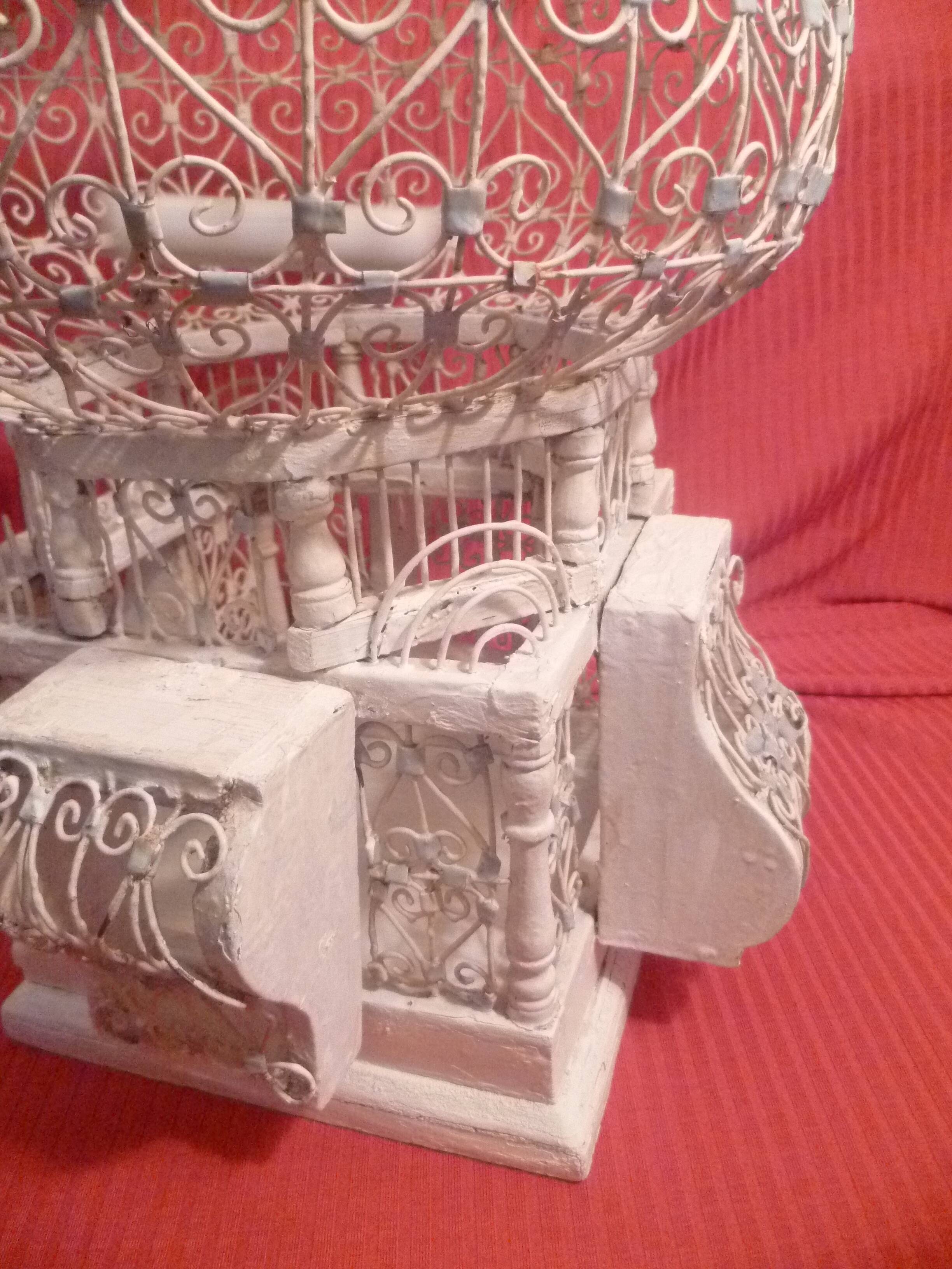 Antique handmade birdcage in metal and wood