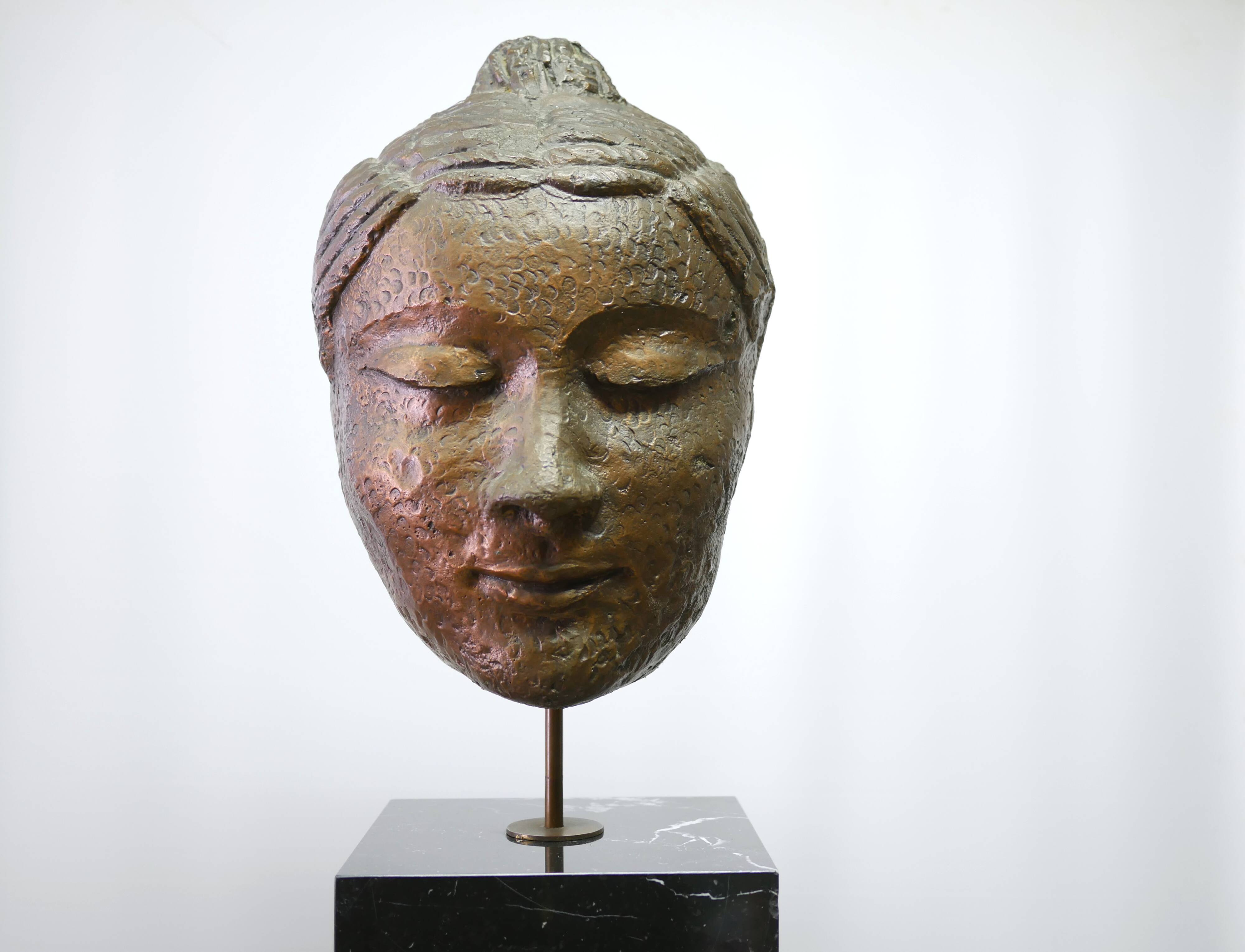 Buddha head sculpture, marble base