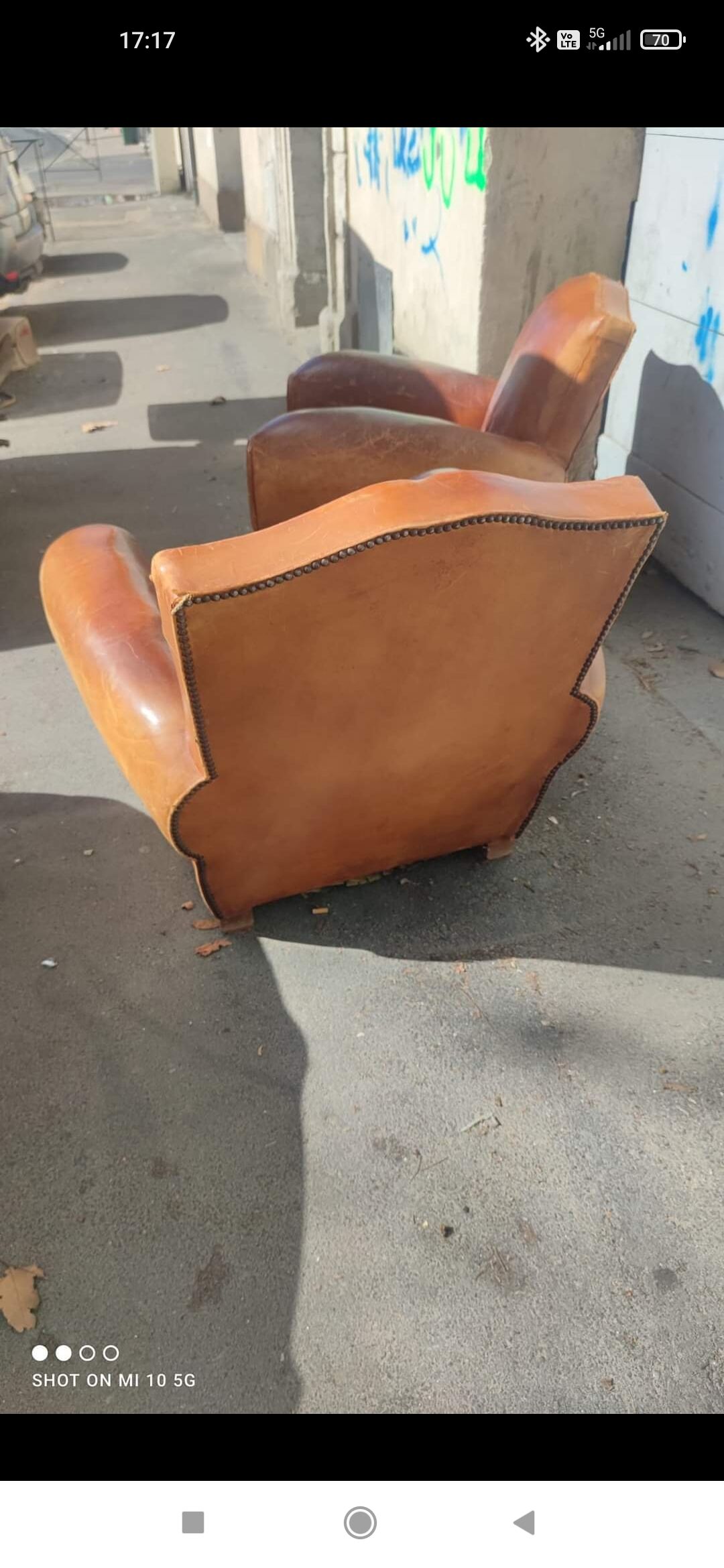 Pair of club chairs with moustache-shaped handles in Havana leather, in their original condition, circa 1930