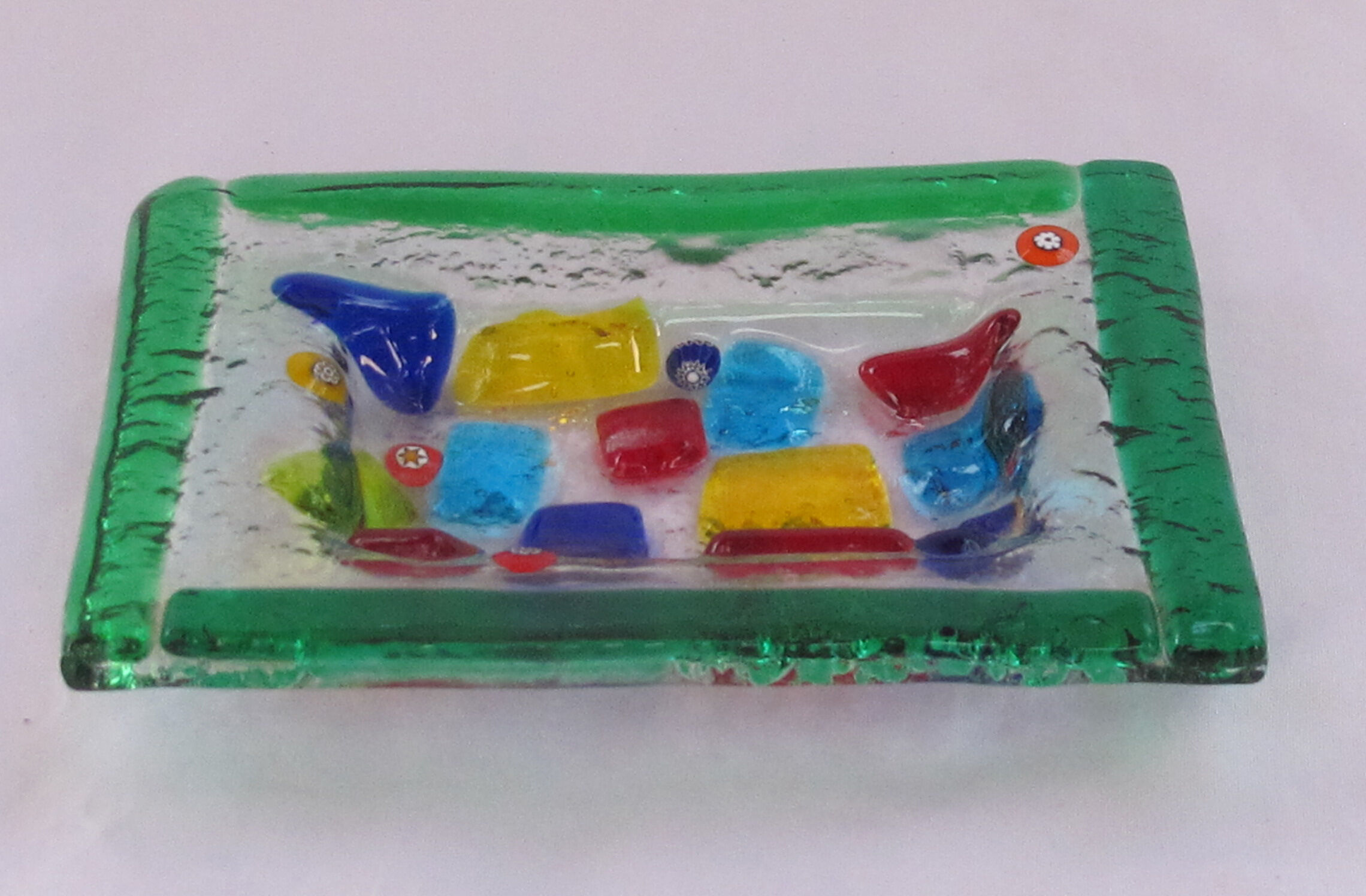 Empty millefiori-style glass pocket