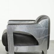 Cow leather aviator design armchair finished with aluminium and rivets