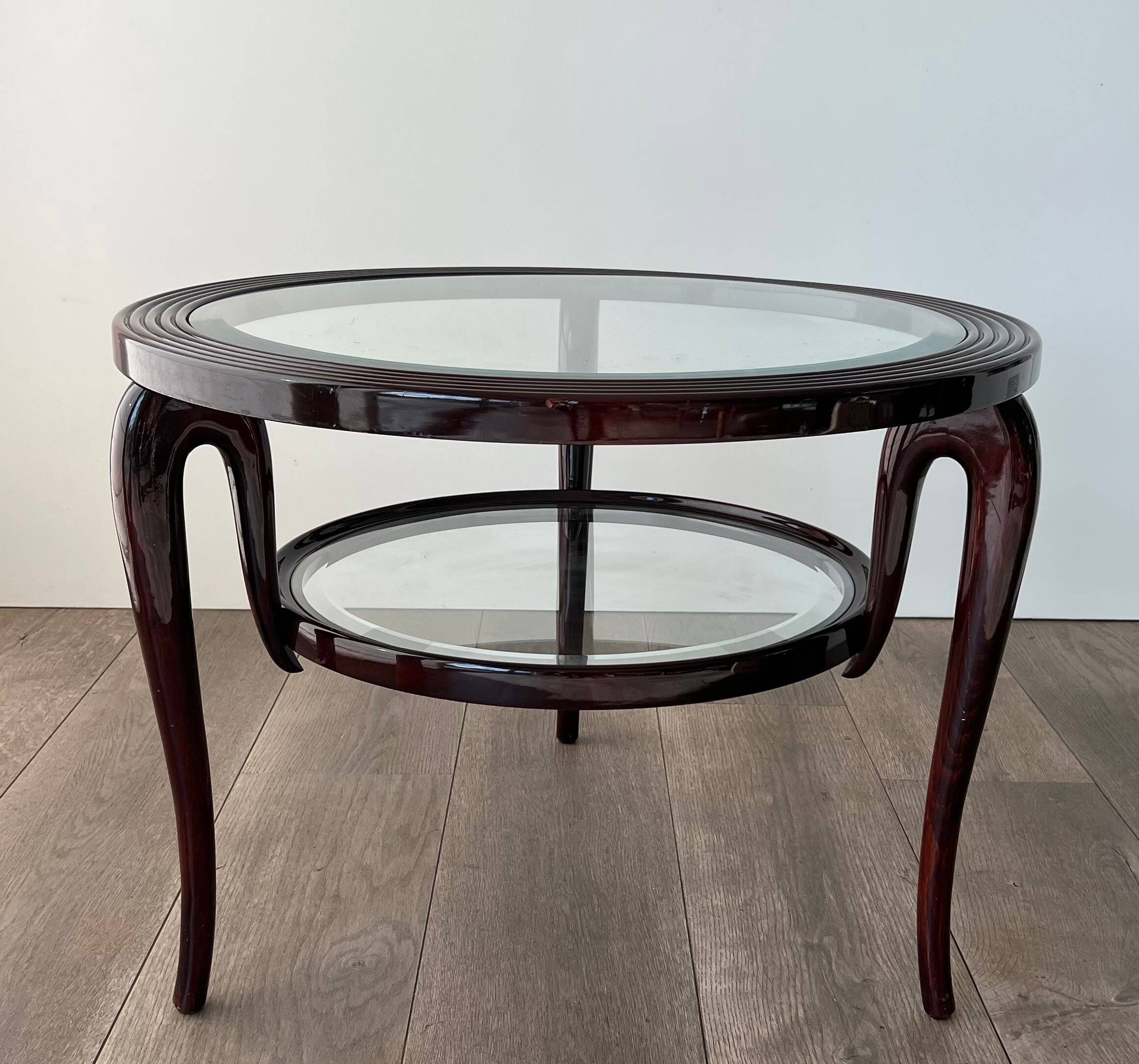 Round mid-century coffee table in walnut with a double top by Paolo Buffa.