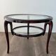 Round mid-century coffee table in walnut with a double top by Paolo Buffa.