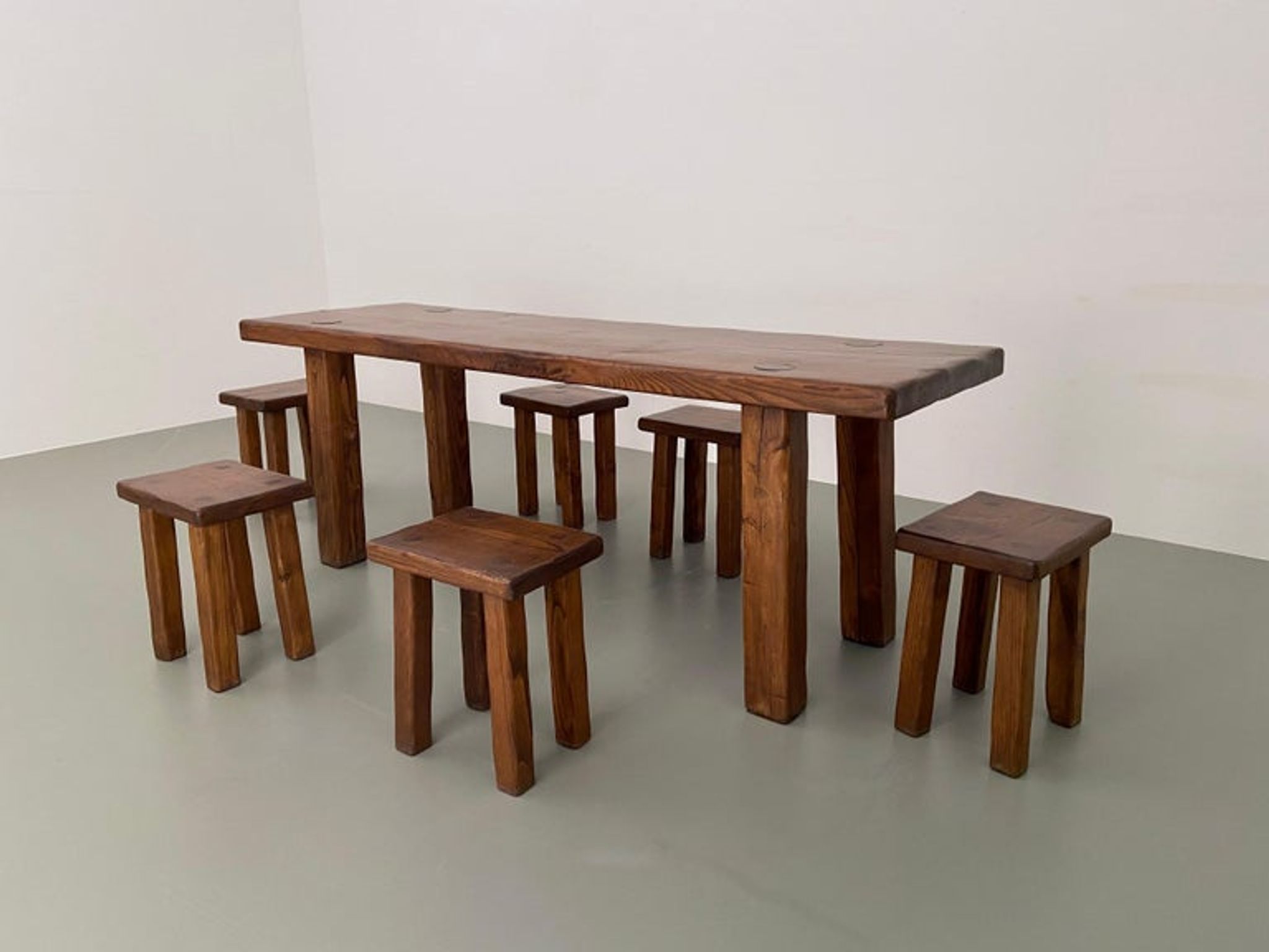 Solid elm dining set including 6 stools France 1970s