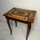 Small antique Italian inlaid table with Swiss music box.