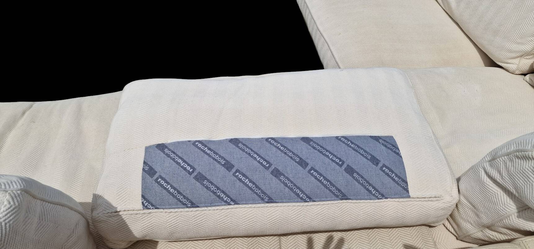 Roche Bobois leather sofa with fabric cushion