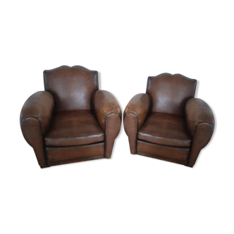 Paire de fauteuils club moustache en cuir