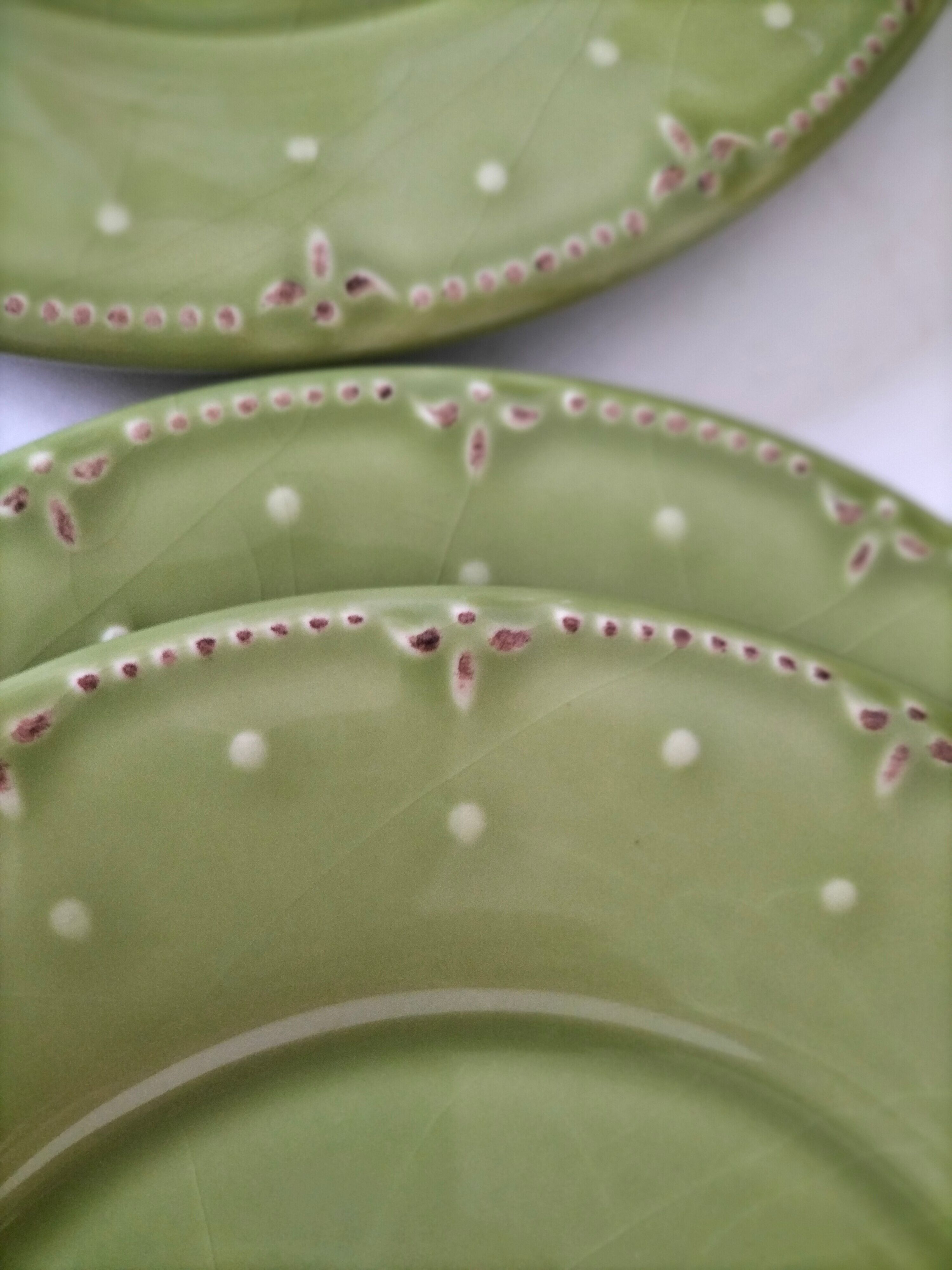 6 olive green plates with dotted relief, workshop ceramic style
