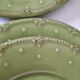 6 olive green plates with dotted relief, workshop ceramic style