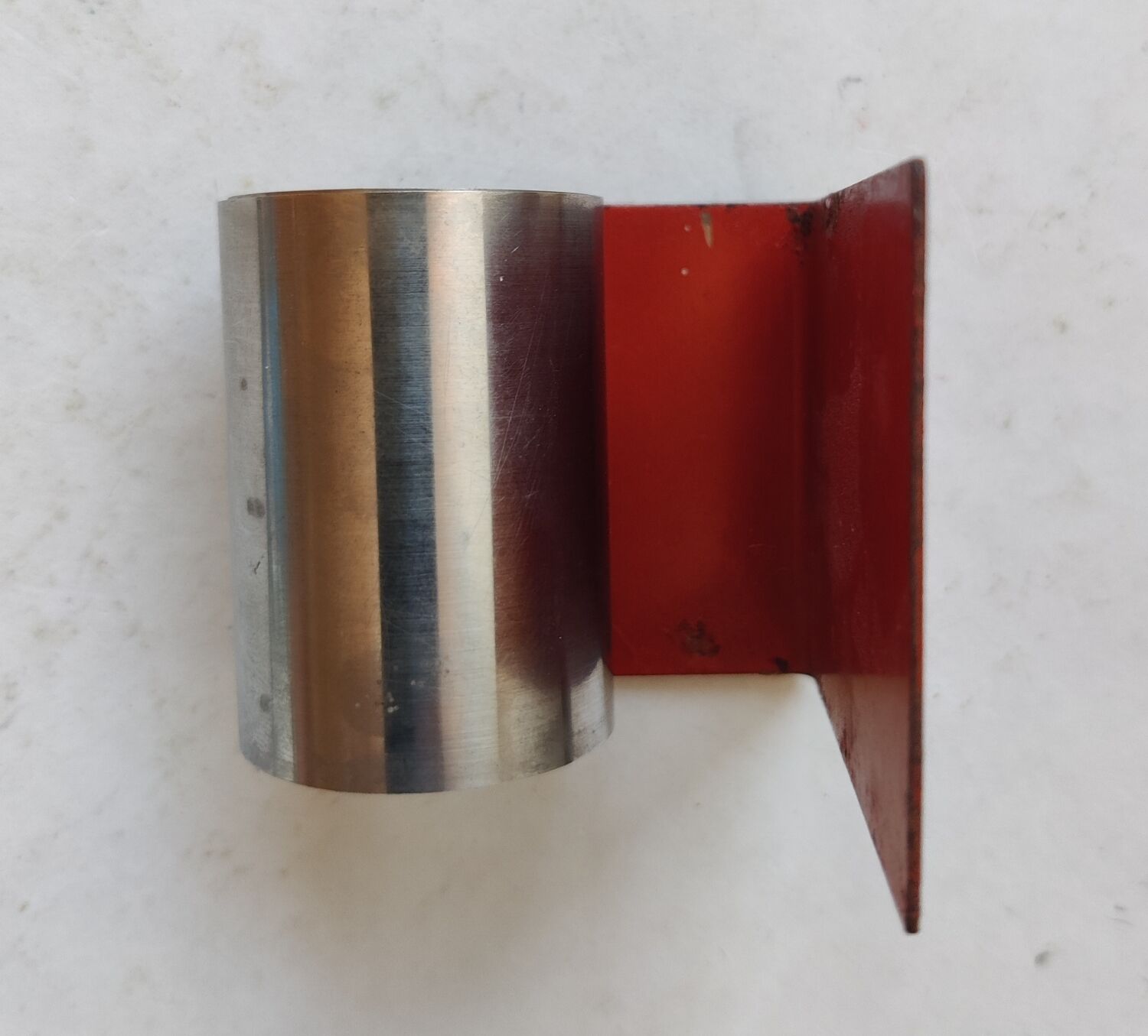 Modernist extendable bookends in brushed stainless steel and red 1970's