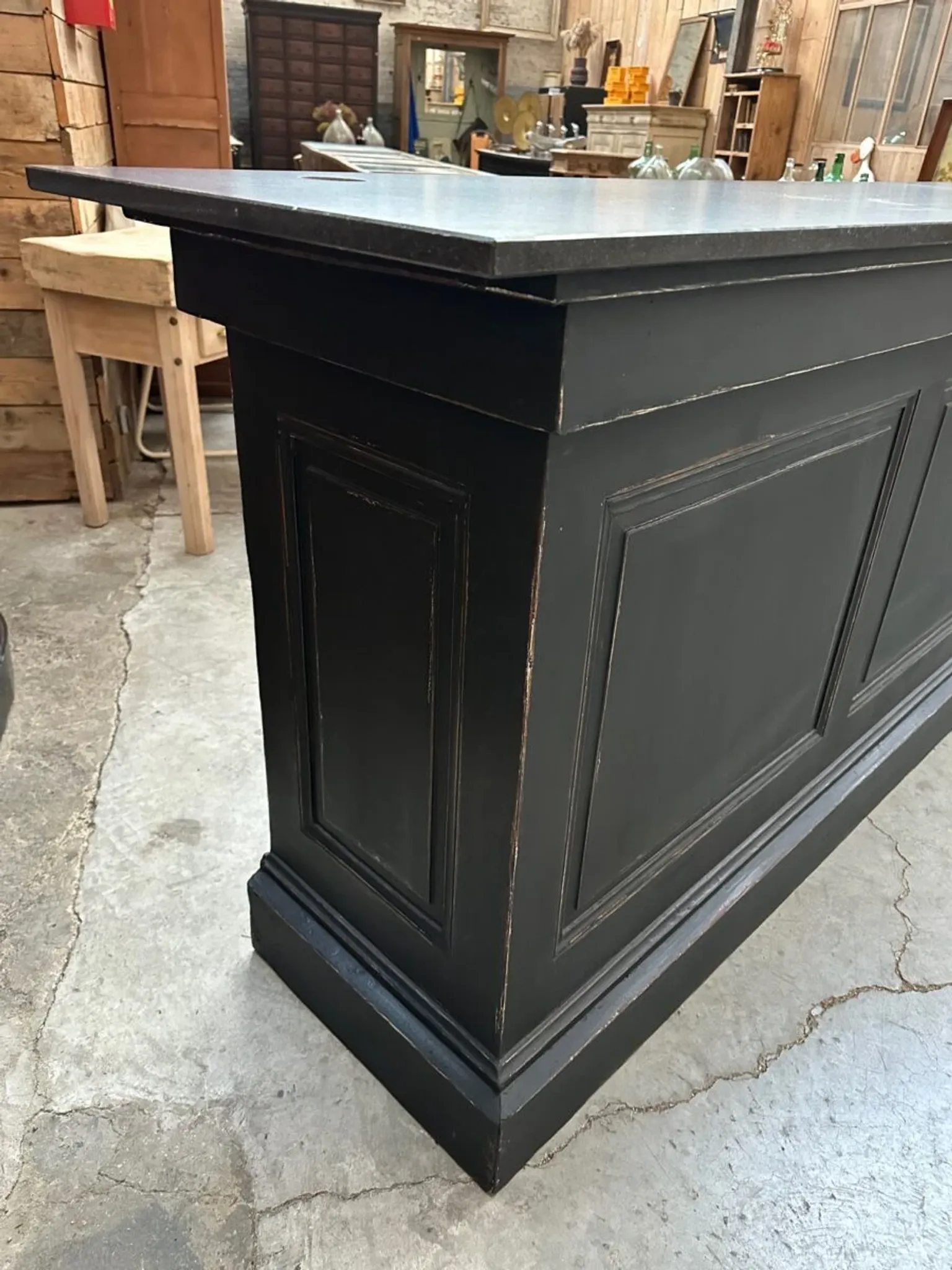 Immense bar counter covered with blue stone.