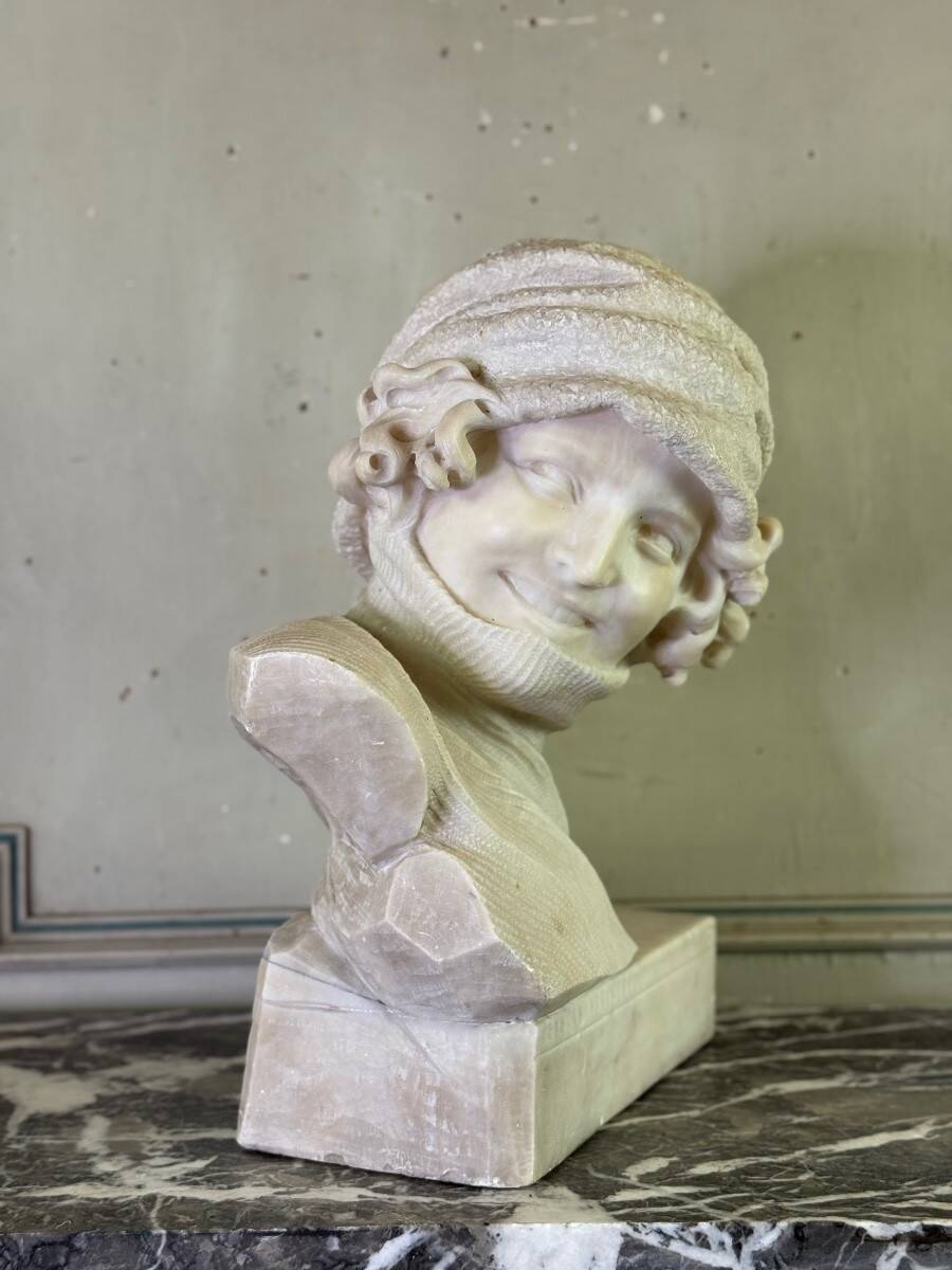 Alabaster bust of a young girl with a turtleneck, signed Caloni, Italy circa 1900