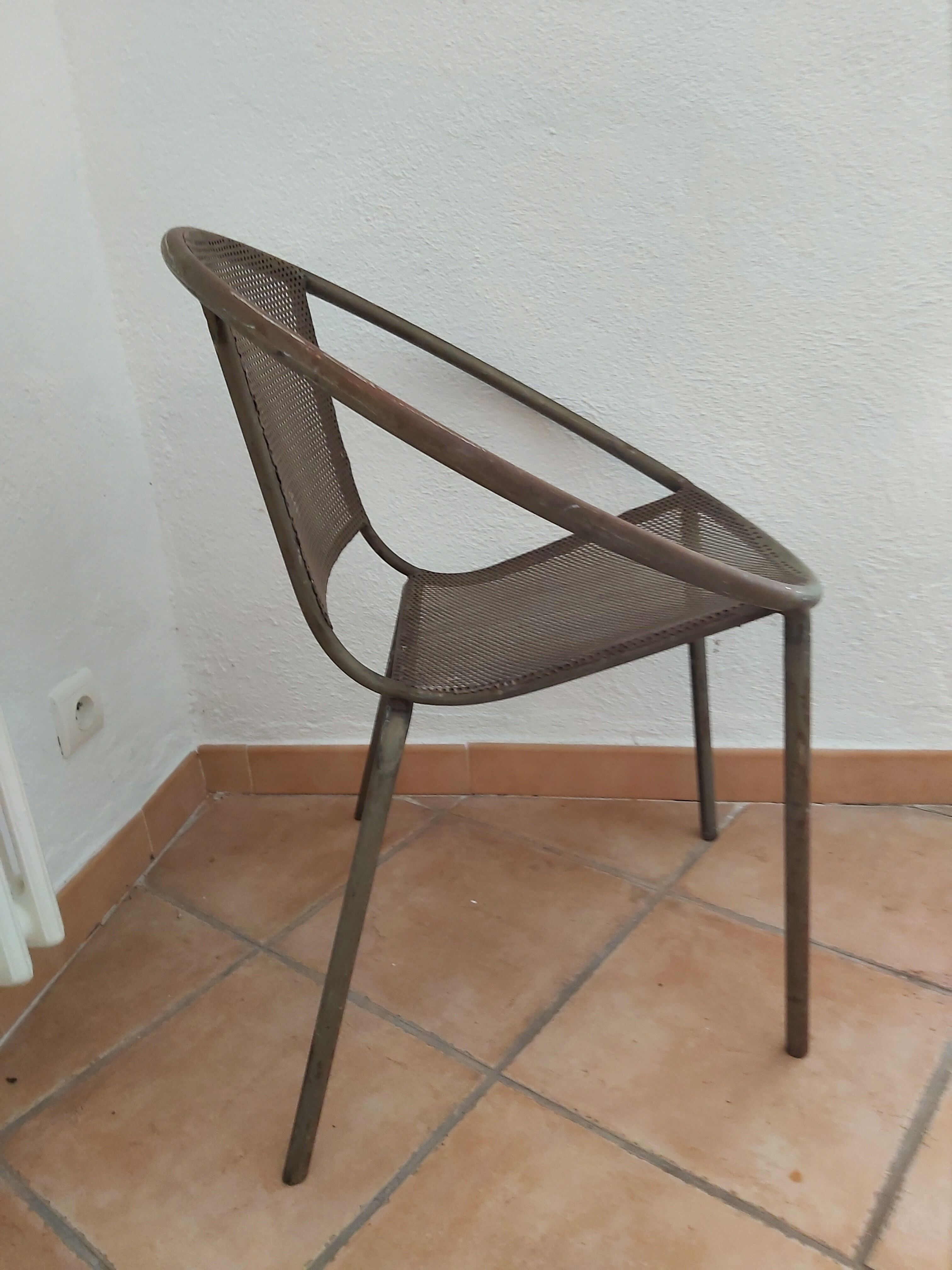 Vintage perforated metal basket armchair