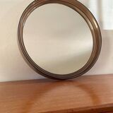 Vintage round smoked plastic mirror, circa 1970s.