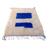 White Moroccan rug with abstract Klein blue patterns
