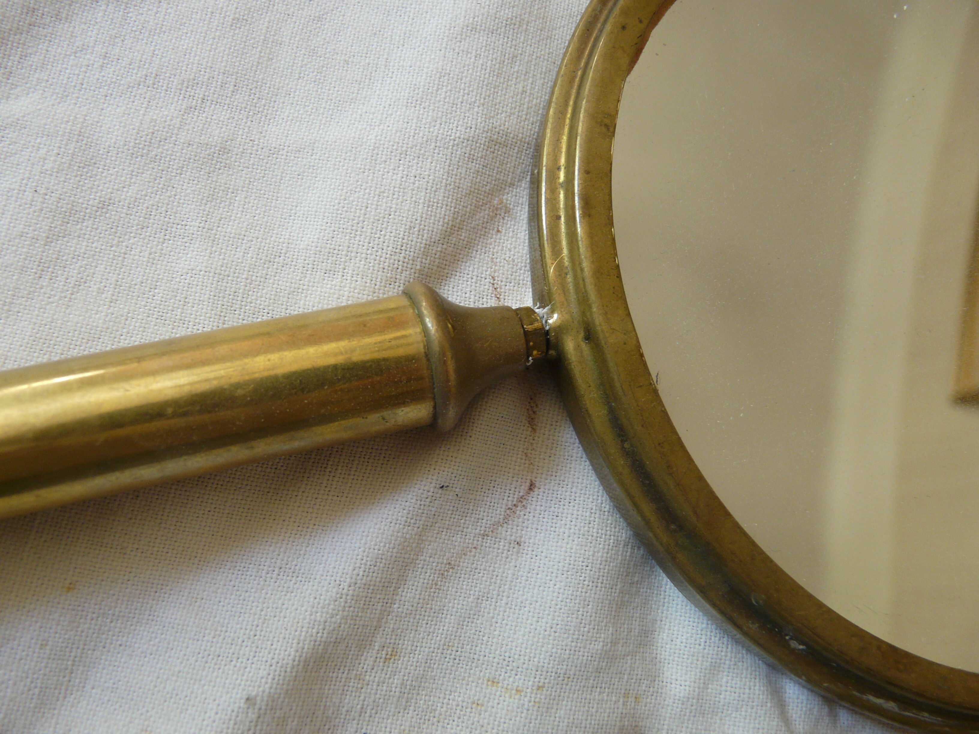 Art Deco era brass hand mirror