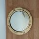 Witch porthole mirror 1940 in vintage gilded brass.
