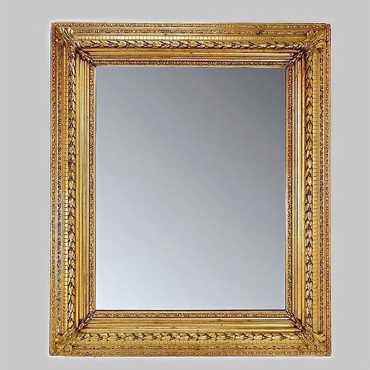 Large gilded wood and stucco mirror with foliage