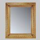 Large gilded wood and stucco mirror with foliage