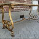 Travertine coffee table, golden foot
