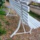Old garden bench with metal legs and wooden slats