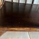 Brown rattan console shelf