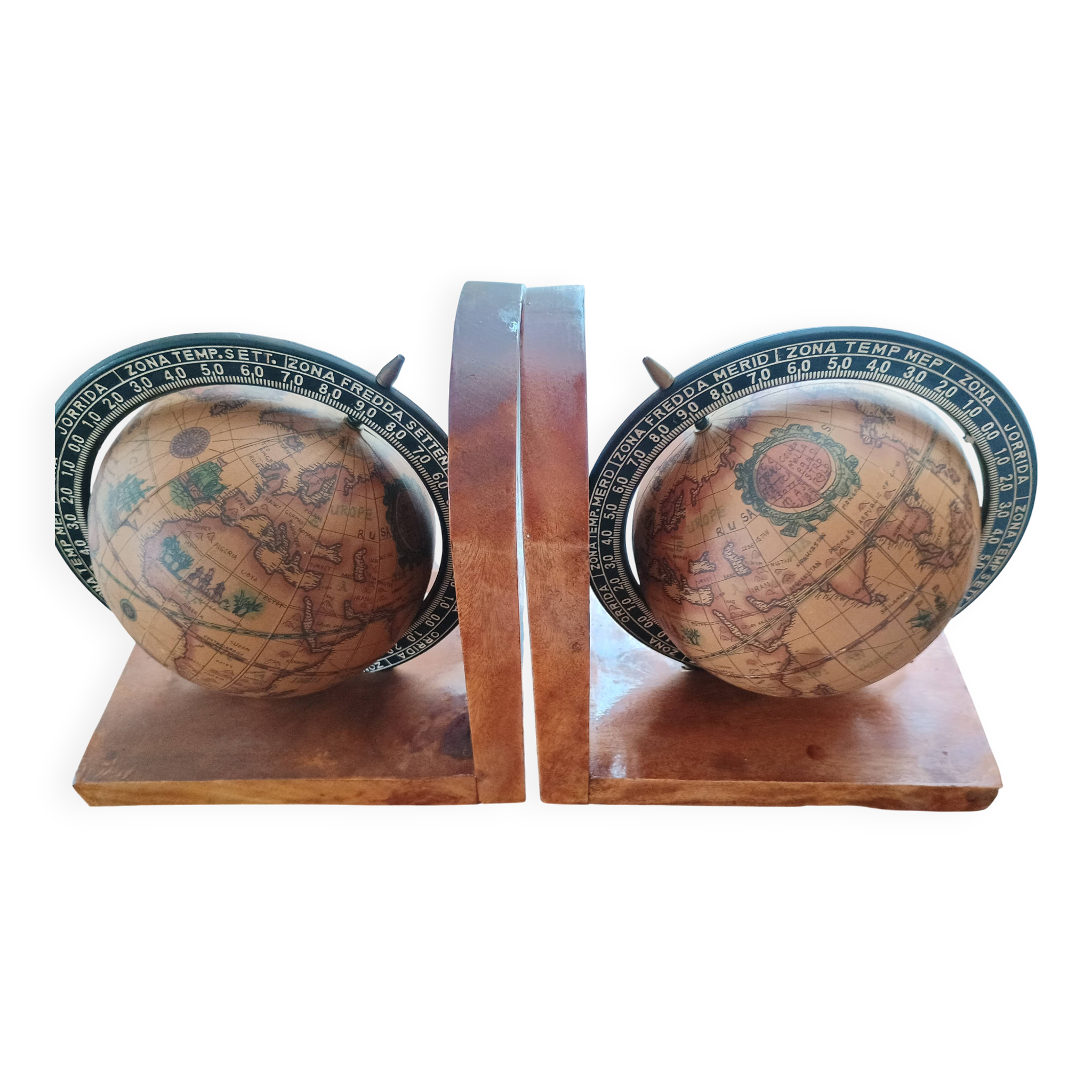 Pair of vintage bookends with rotating terrestrial globes on wooden bases in Spain