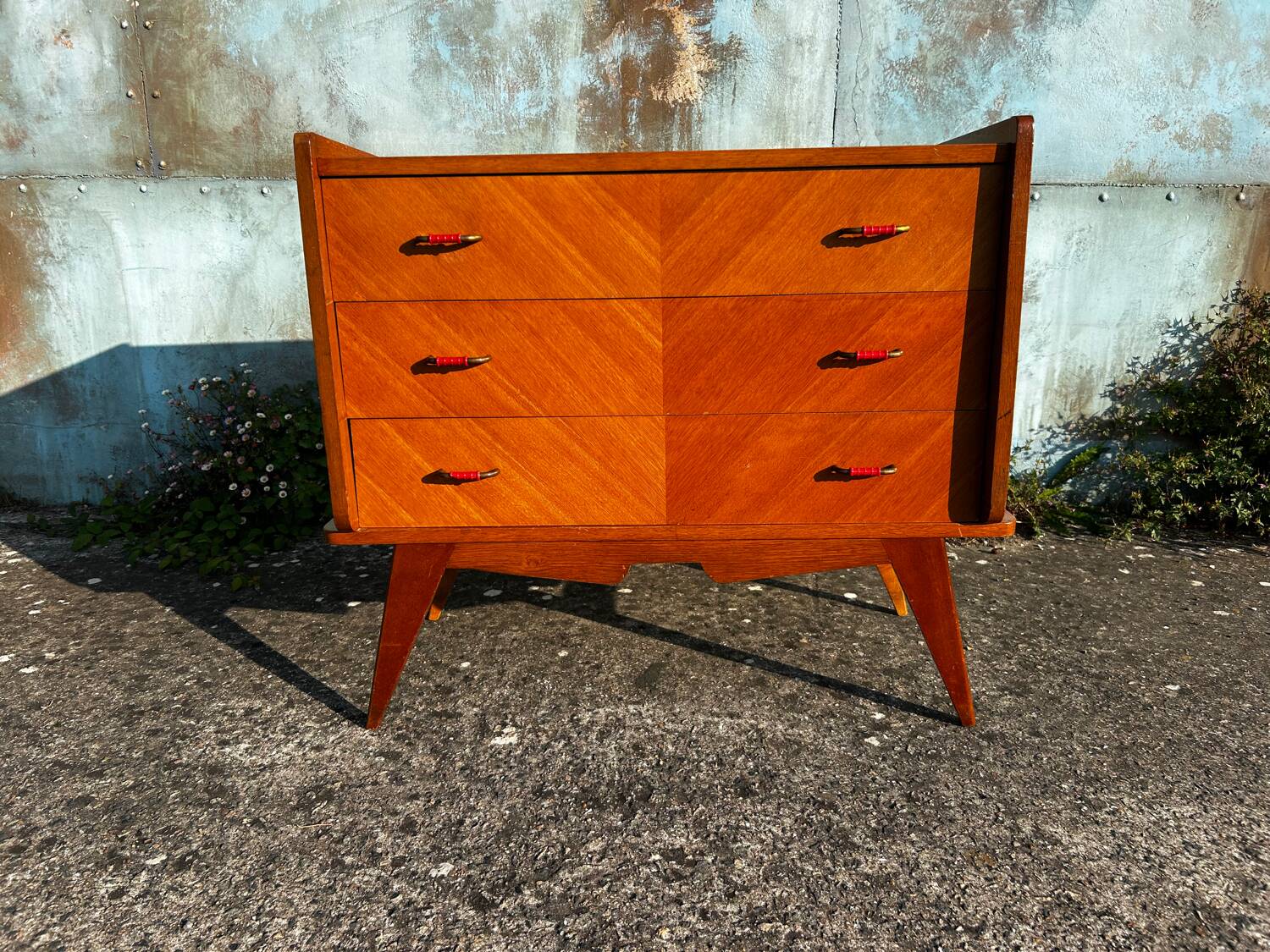 Vintage chest of drawers with compass feet.