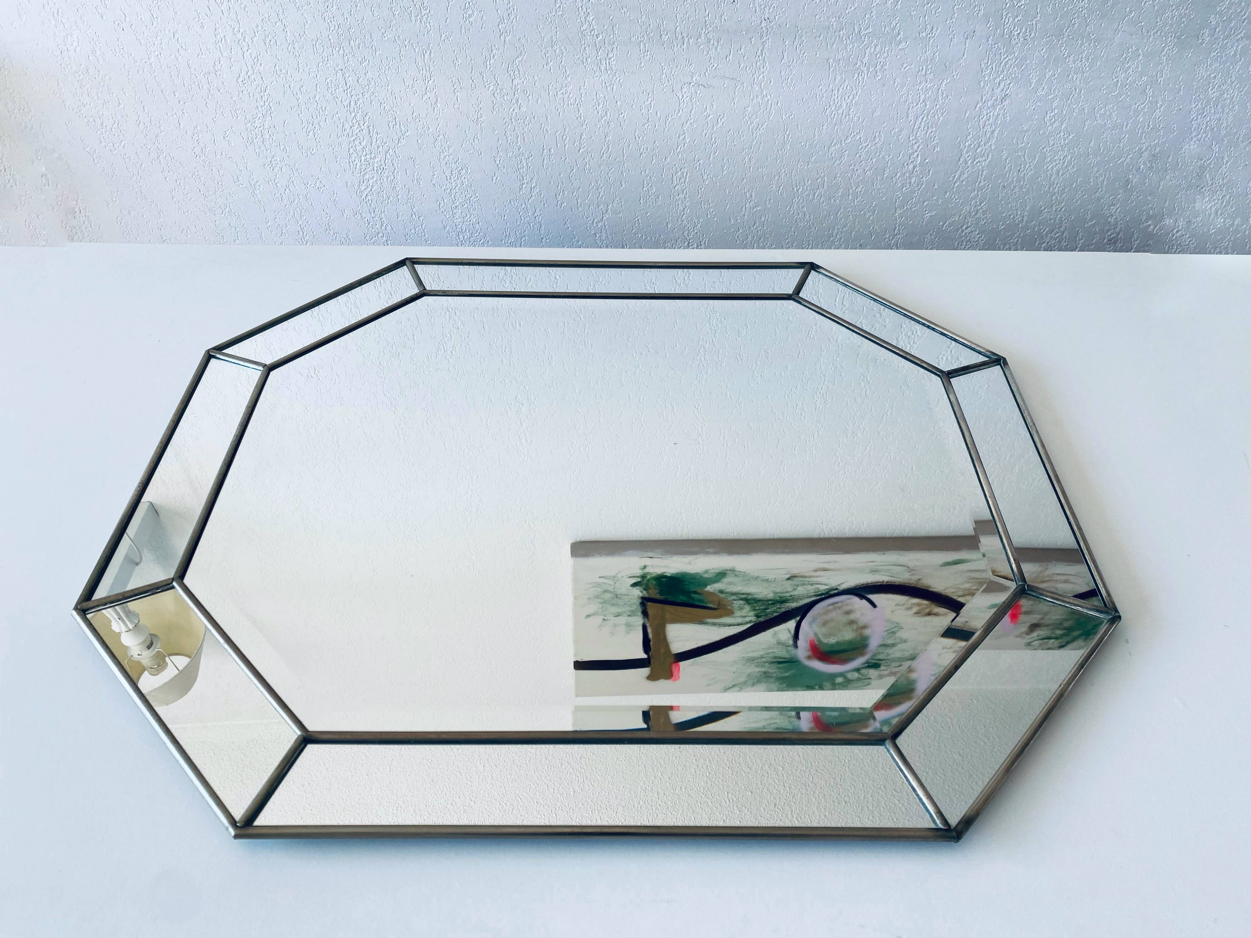 Old octagonal beveled mirror with parcloses