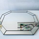 Old octagonal beveled mirror with parcloses
