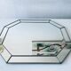 Old octagonal beveled mirror with parcloses