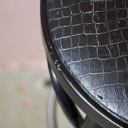 Pair of 1960s bistro bar stools in black and chrome with vinyl shell.