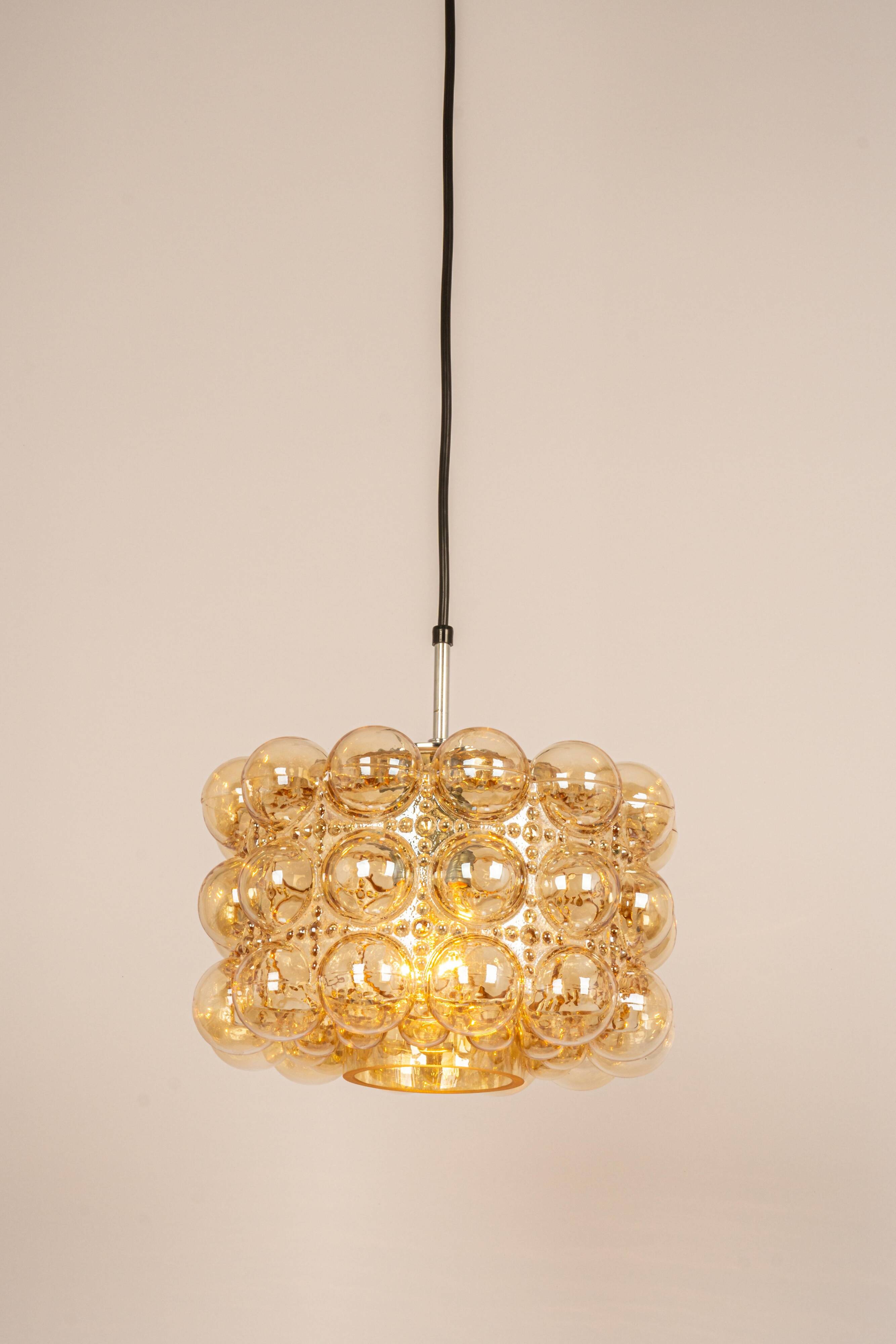 Large amber bubble glass pendant light by Helena Tynell for Limburg, Germany, 1970s.