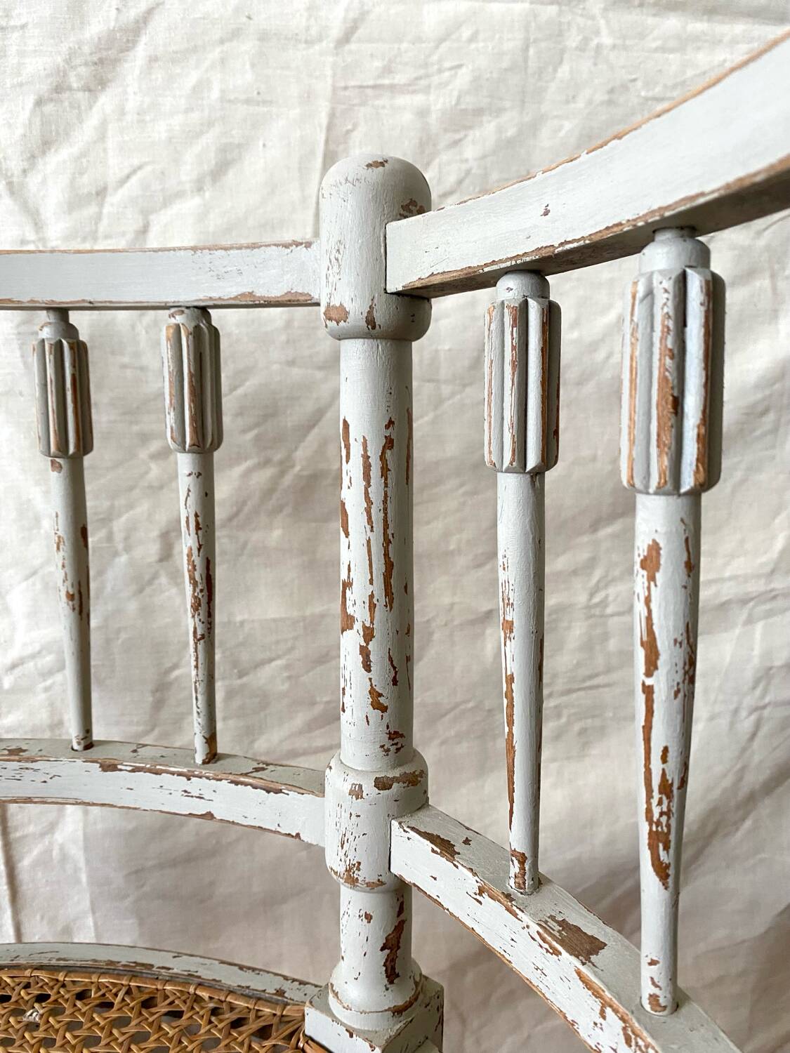 19th-century corner fireplace armchair, wood and cane.