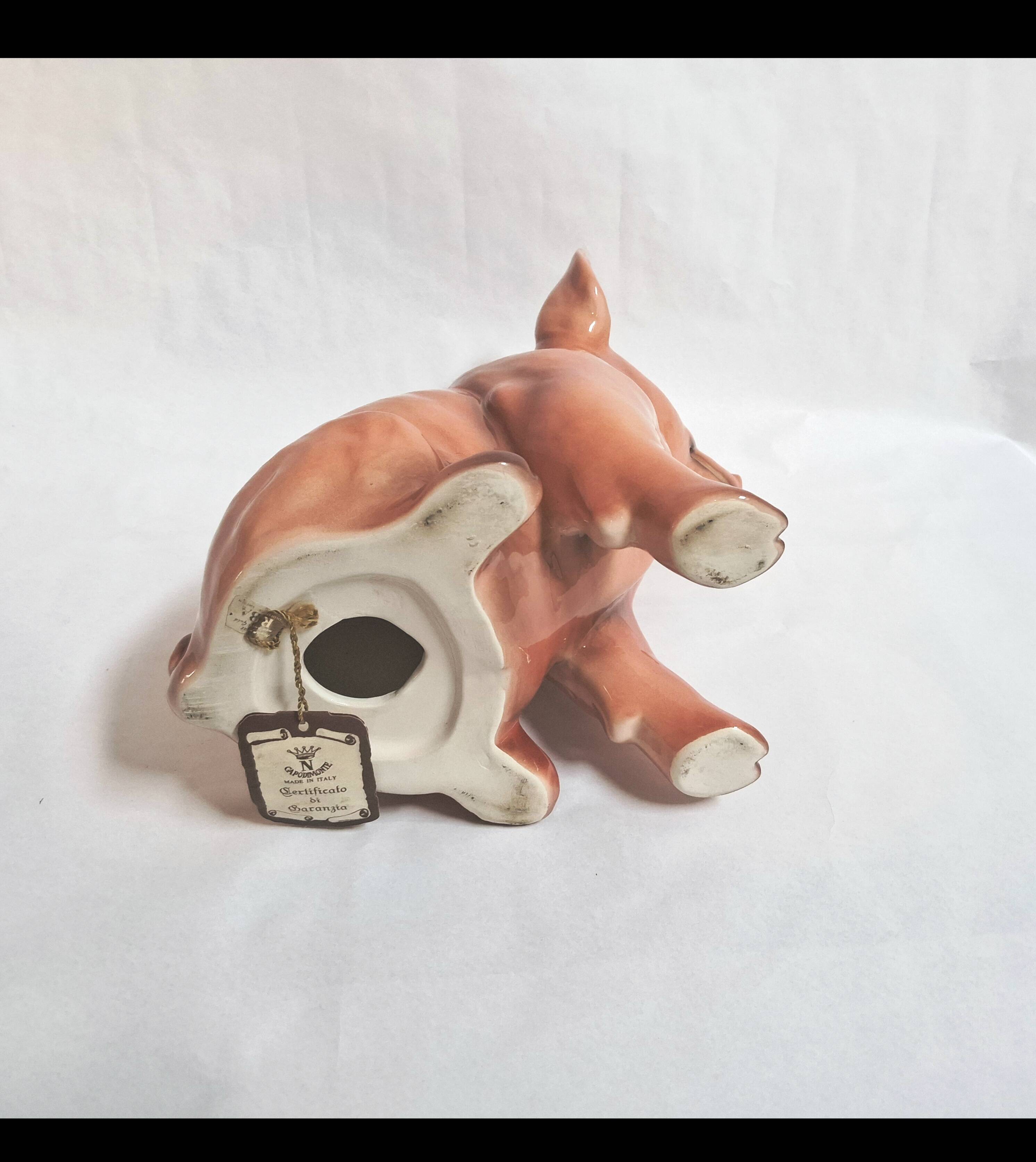 Beautiful, handcrafted porcelain figurine of a piglet, made by Capodimon.