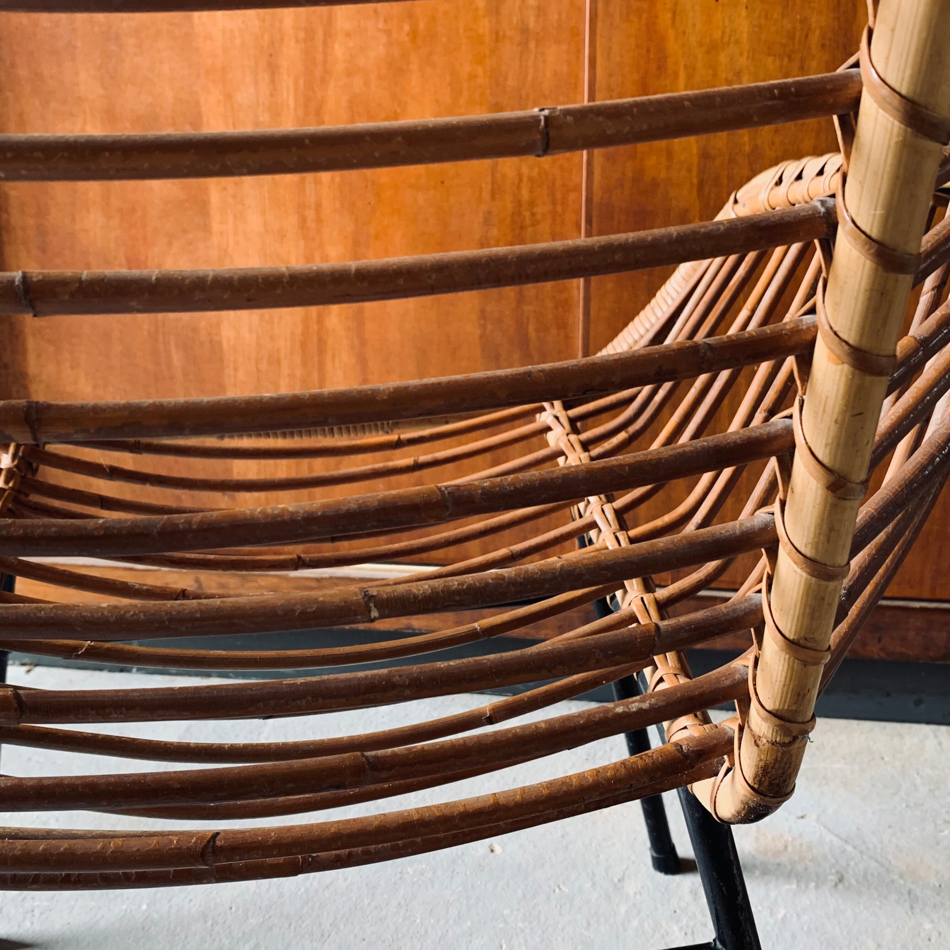 Rattan armchair and black metal base 1960