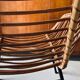 Rattan armchair and black metal base 1960