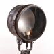 Old industrial spot on wooden tripod floor lamp