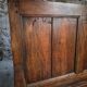 Rustic French antique storage bench from the 18th century in walnut and pine.