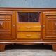 Low buffet in carved oak, Art Deco style, circa 1930.