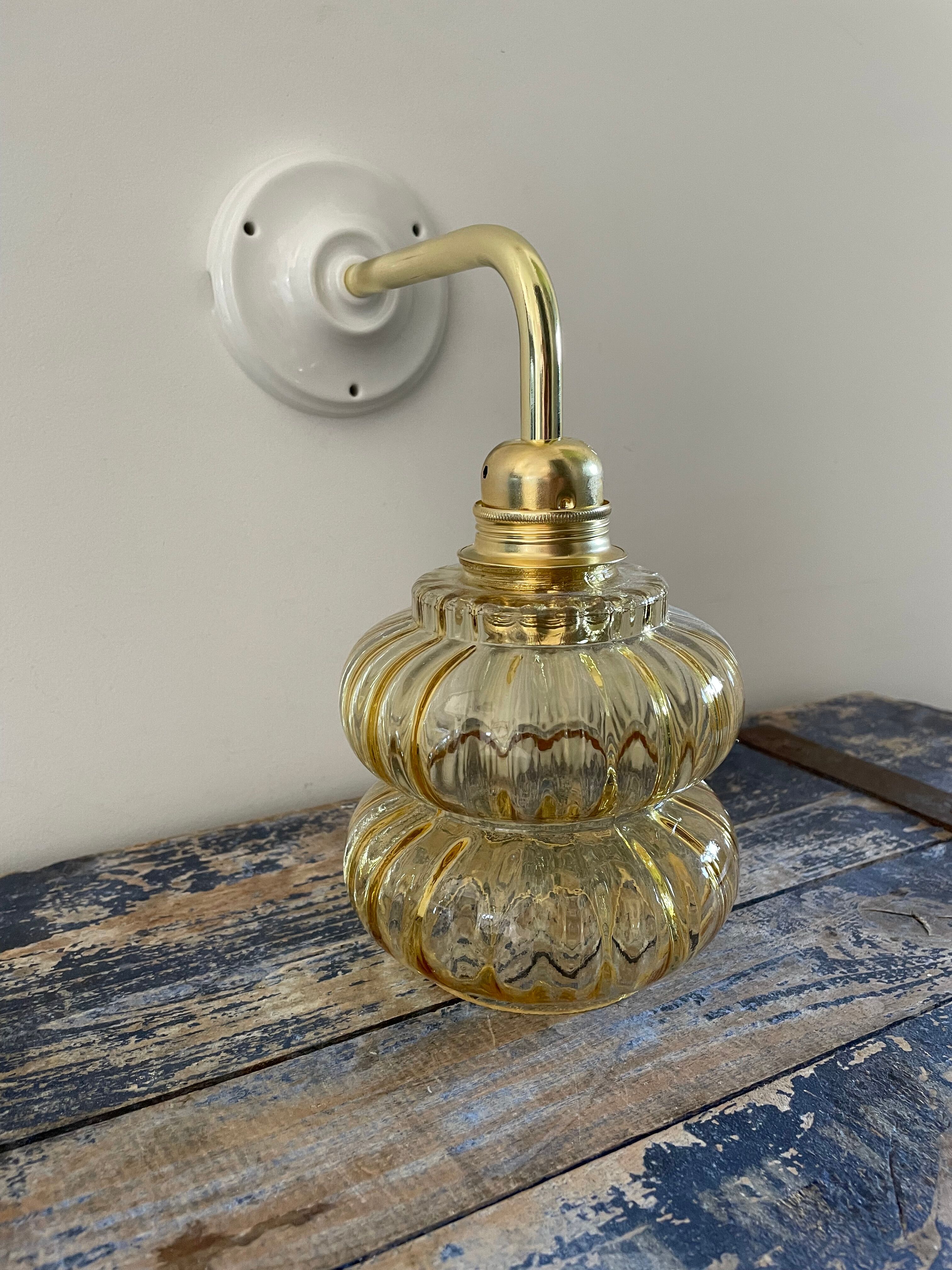Vintage wall lamp in gilded chiseled glass