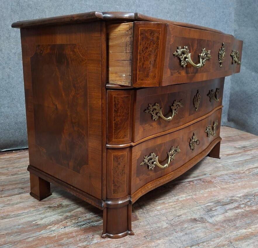 Curved commode from the Louis XIV period in marquetry - adorned with gilded bronze fittings.