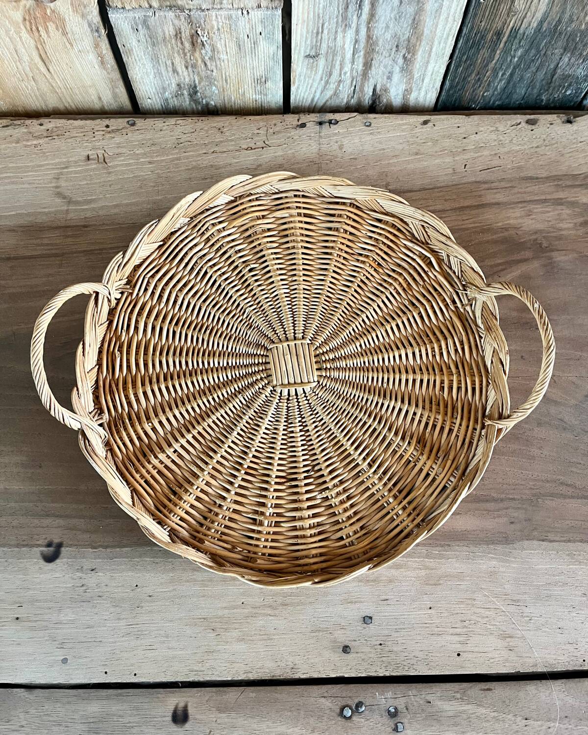 Antique flat round rattan basket