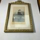 Old photo frame in golden brass floral decoration and small knot 18th With glass
