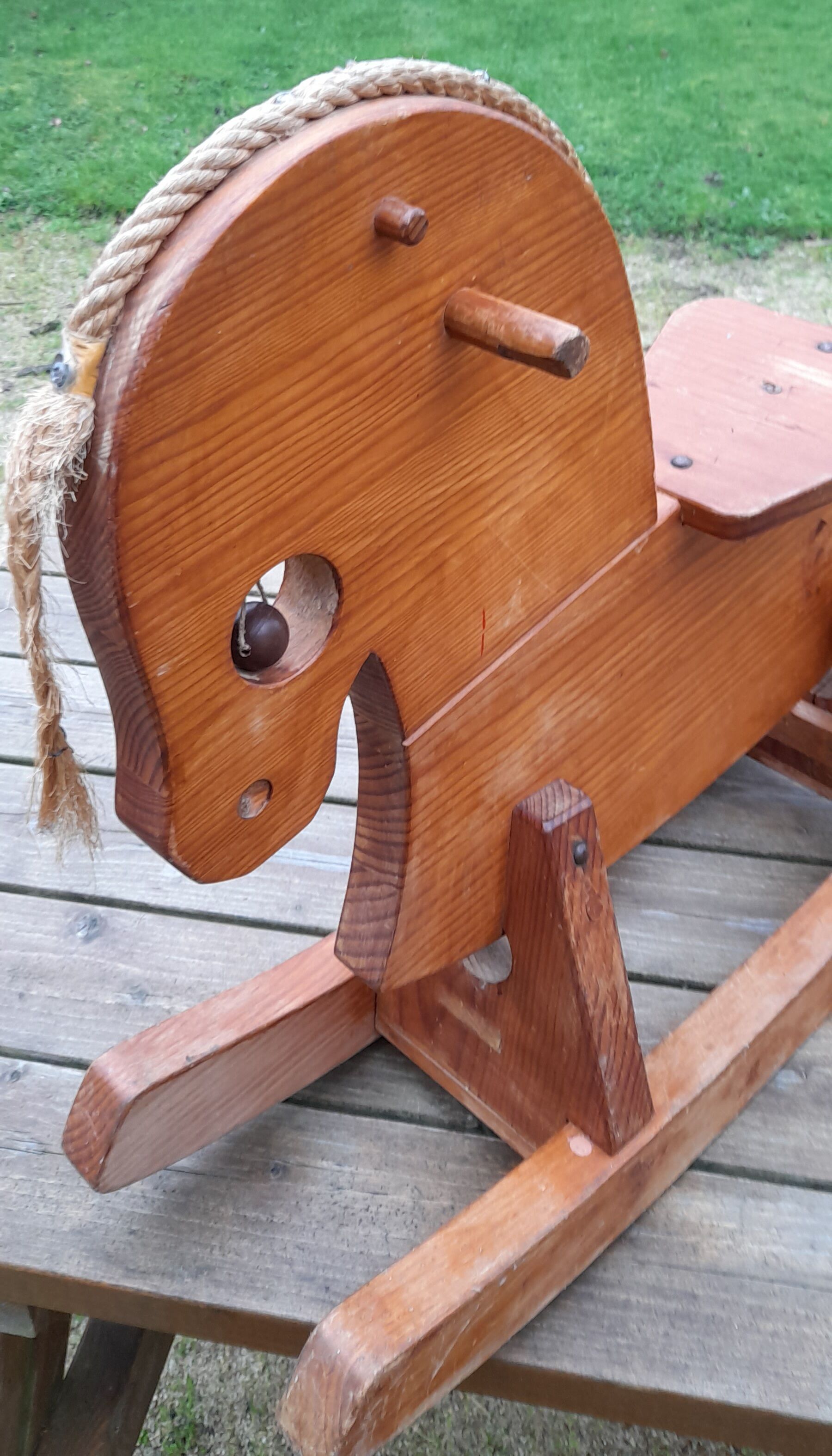 Rocking horse in raw and glazed wood
